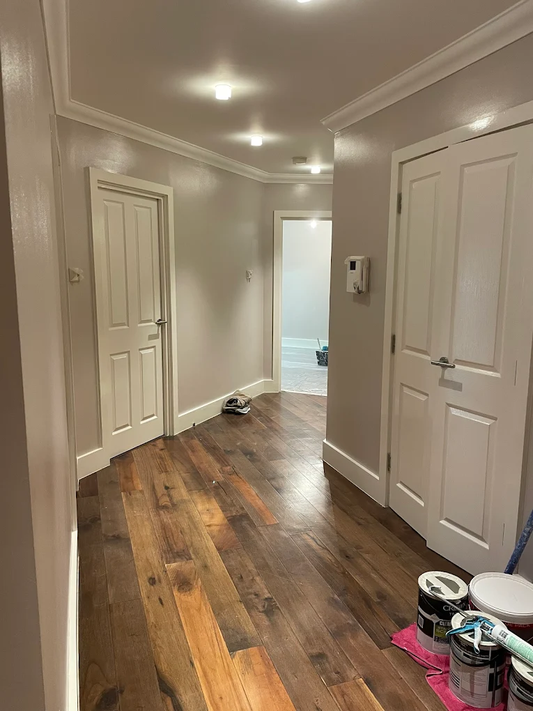 Newly painted North London hallway with cream walls and white doors