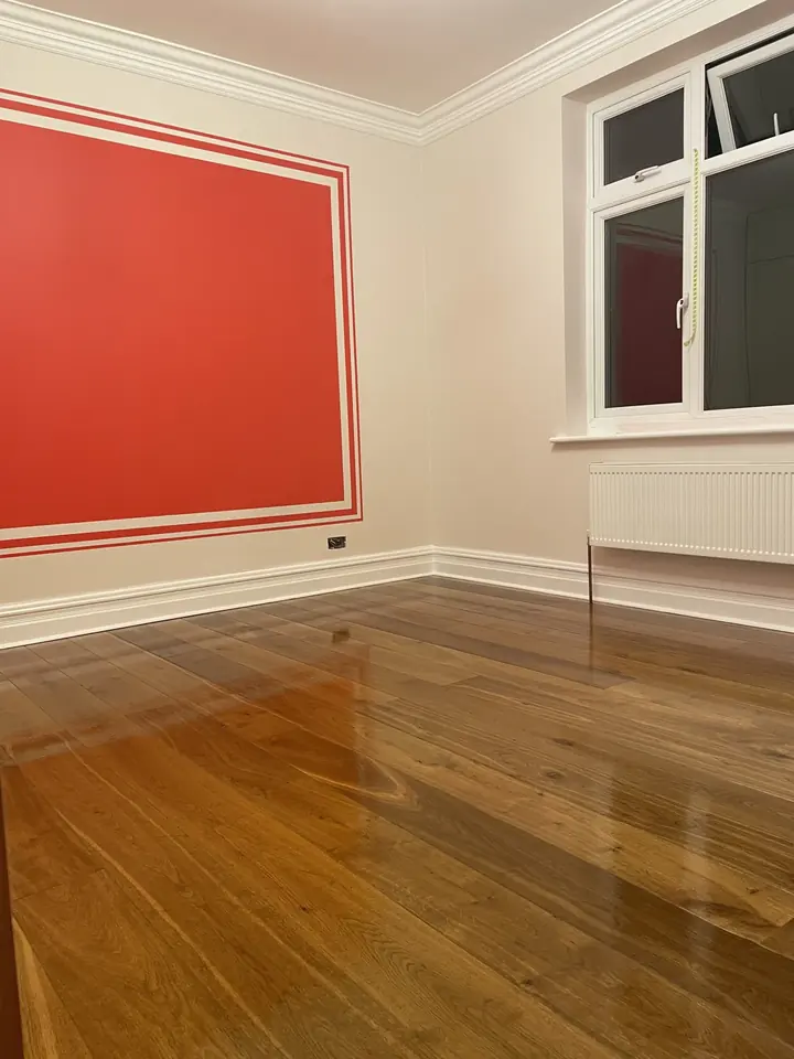 Red painted panel feature wall in a finished room