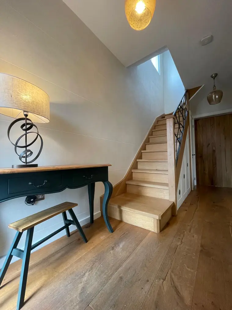 Islington entrance hall with warm polished plaster walls and a softly reflective mineral finish