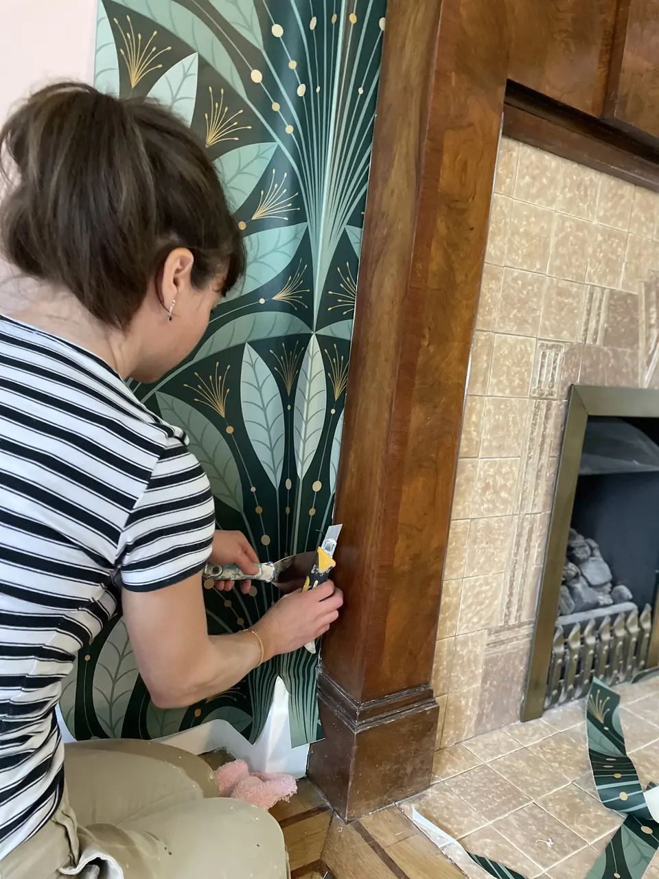 Highgate reception room with sage-painted walls, botanical wallpaper and original period detailing in-progress view