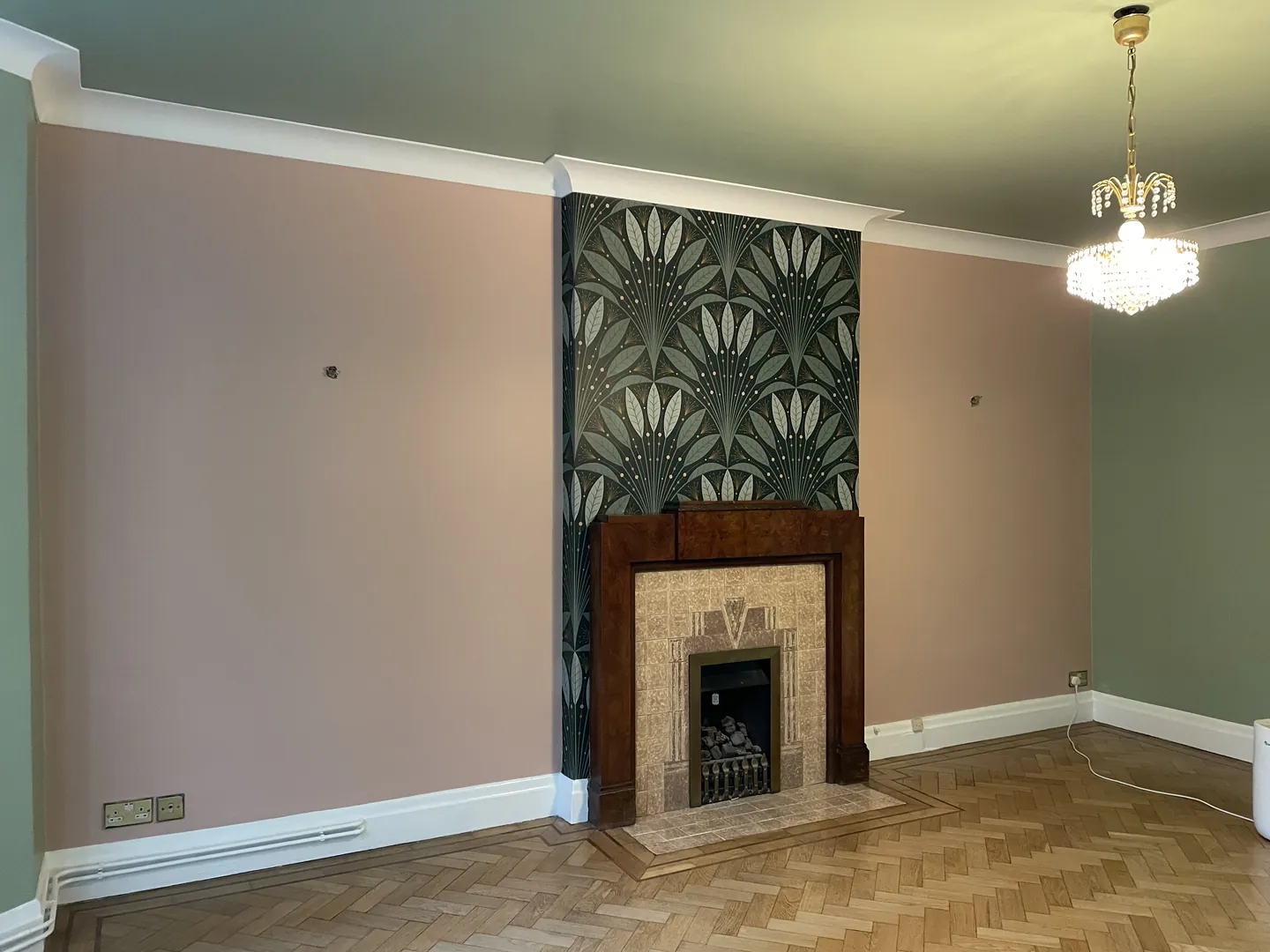 Highgate reception room with sage-painted walls, botanical wallpaper and original period detailing finished result