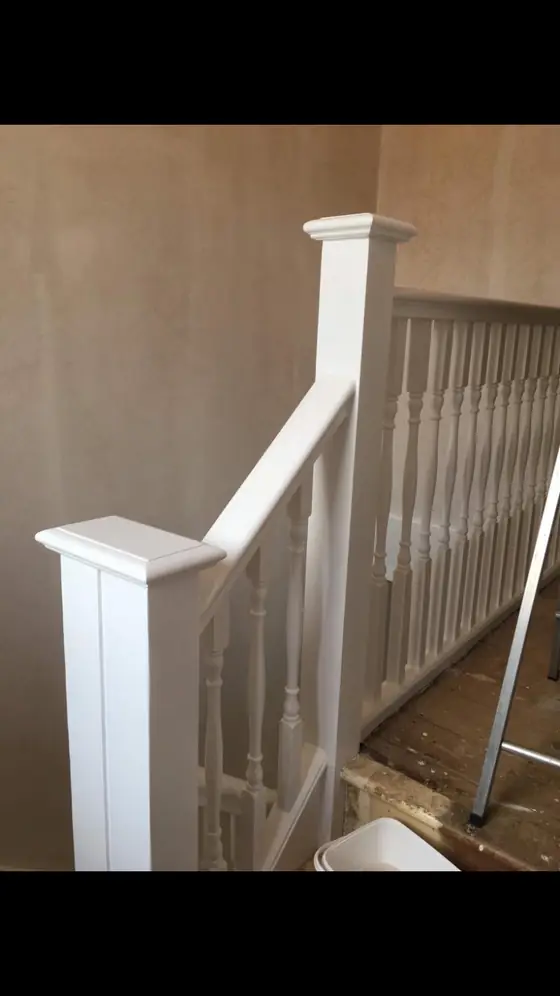 Crouch End period stairwell with restored white balusters, stained wooden treads and warm white walls additional project view 1