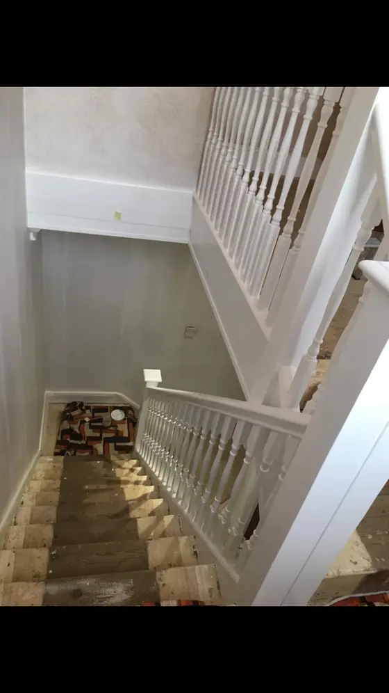 Crouch End period stairwell with restored white balusters, stained wooden treads and warm white walls additional project view 3