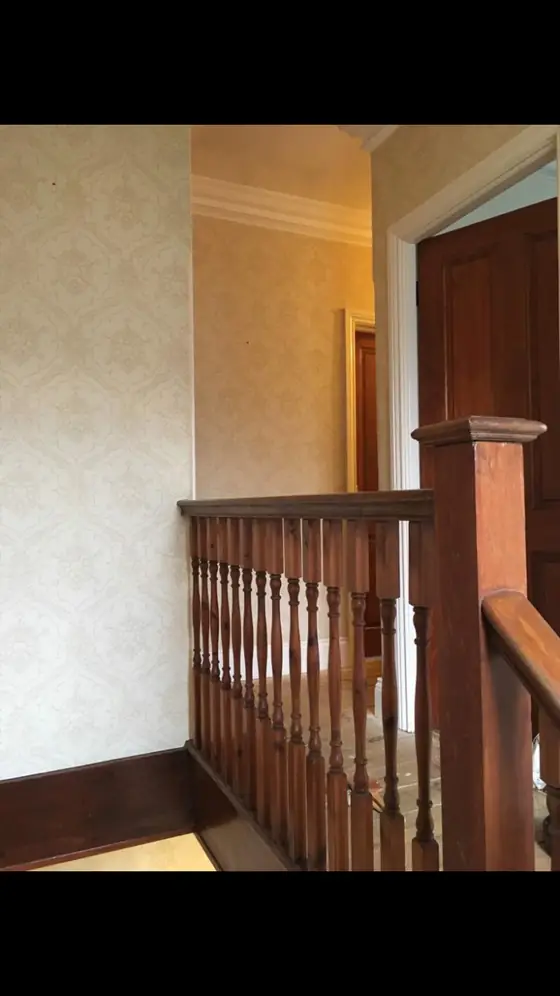 Crouch End period stairwell with restored white balusters, stained wooden treads and warm white walls additional project view 6