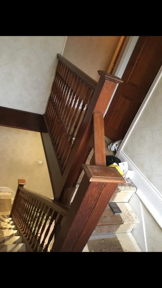 Crouch End period stairwell with restored white balusters, stained wooden treads and warm white walls additional project view 7