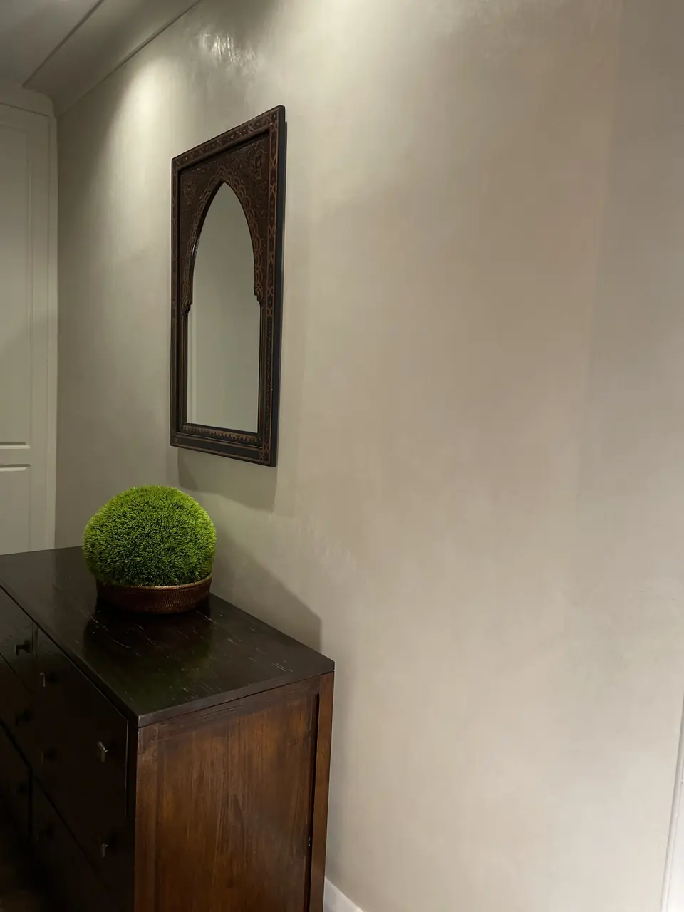 Hampstead interior with warm Venetian plaster carried through connected living spaces close detail